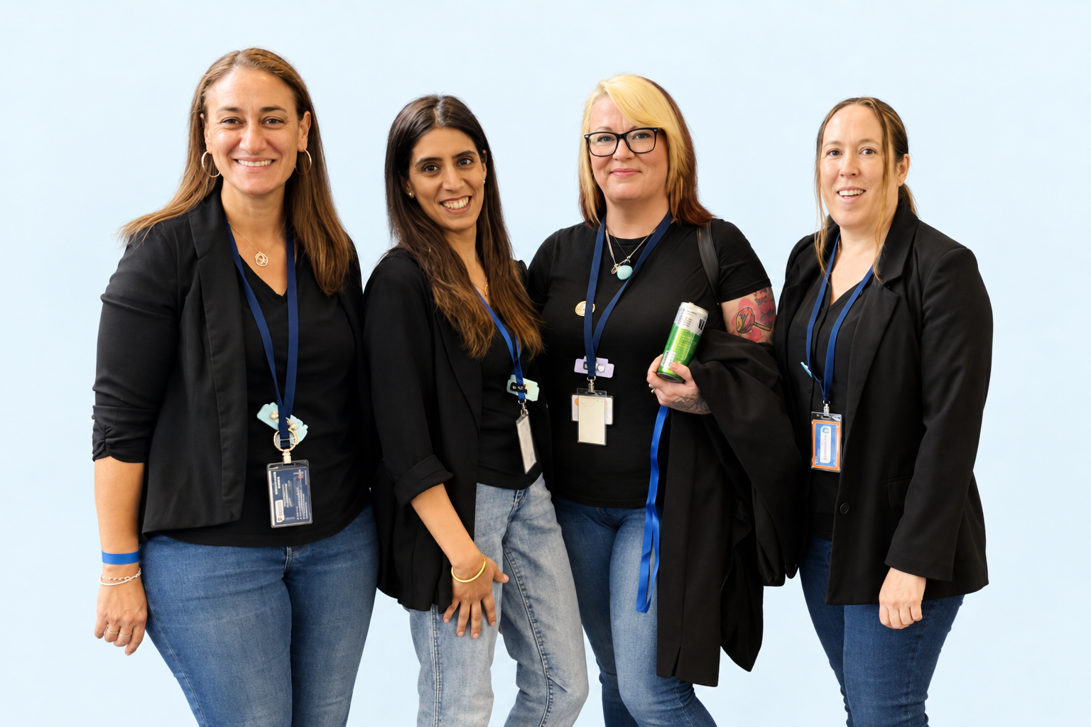Four Care Origin team members standing together